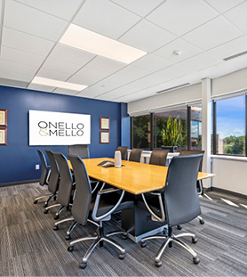 The conference room of Onello & Mello with a table and chairs