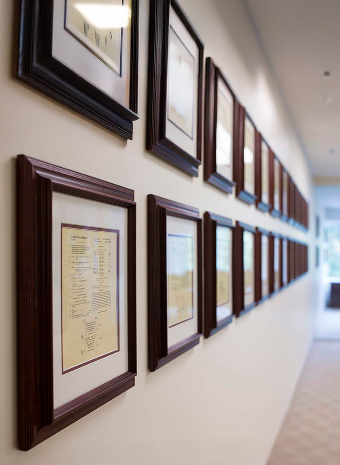 Framed patents hanging on a wall