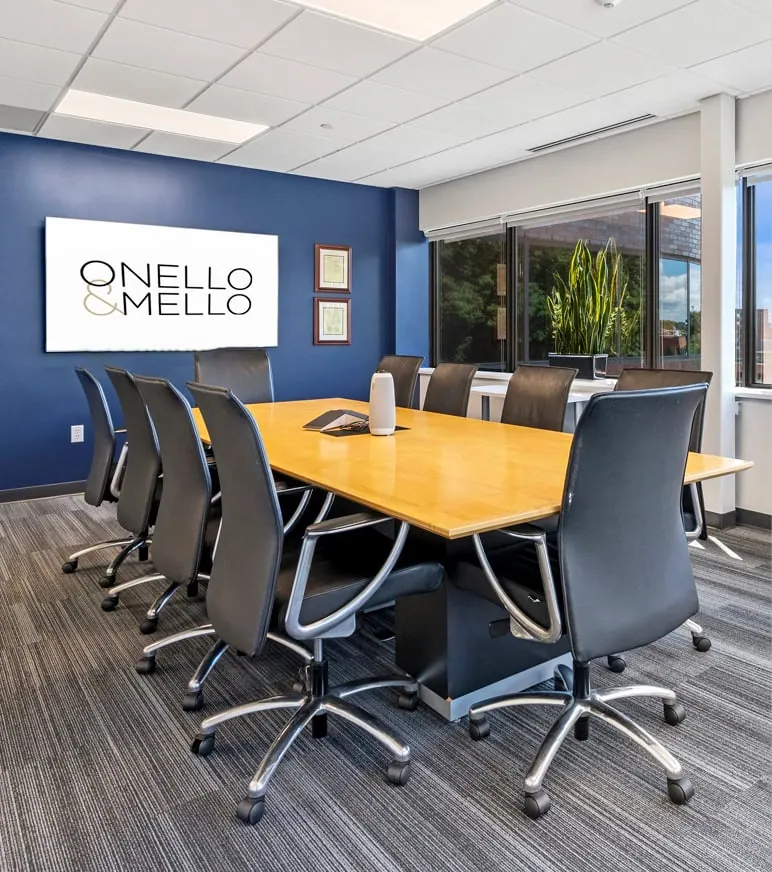 The conference room of Onello & Mello with a table and chairs