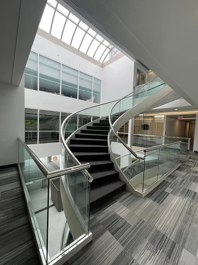 A curved staircase in an office building atrium